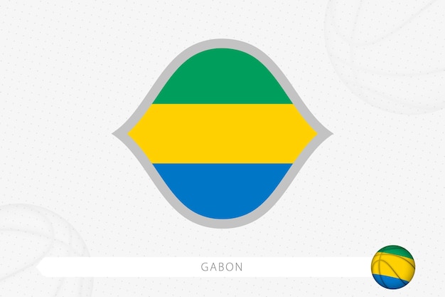 Gabon flag for basketball competition on gray basketball background.