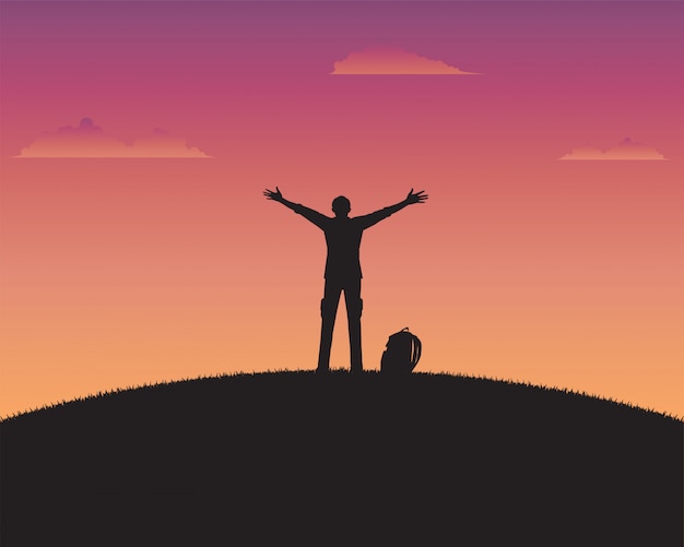 Gelukkig silhouet een mens van zonsondergangachtergrond