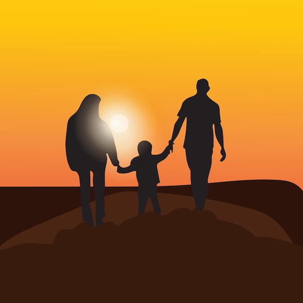 Gelukkige familie silhouet bij de zonsondergang