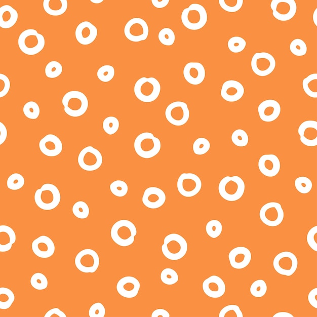 Geometric vector seamless pattern with hand drawn doodle circles on an orange background