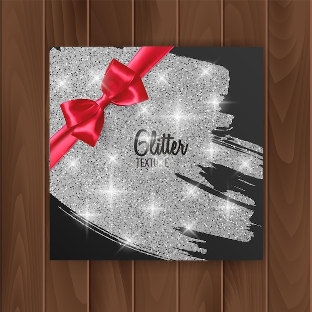 Gift card cover with silver glittering texture and red bow