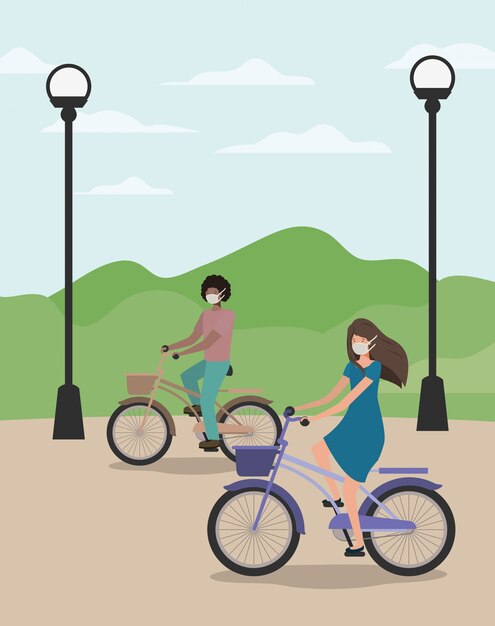 Girl and boy with medical mask on cycle at park