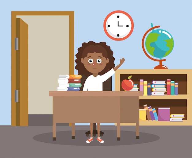 Girl in the classroom with books and apple with desk