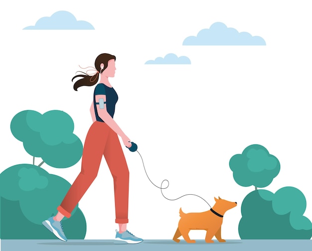 A girl is walking in the park with her dog. Active and healthy lifestyle