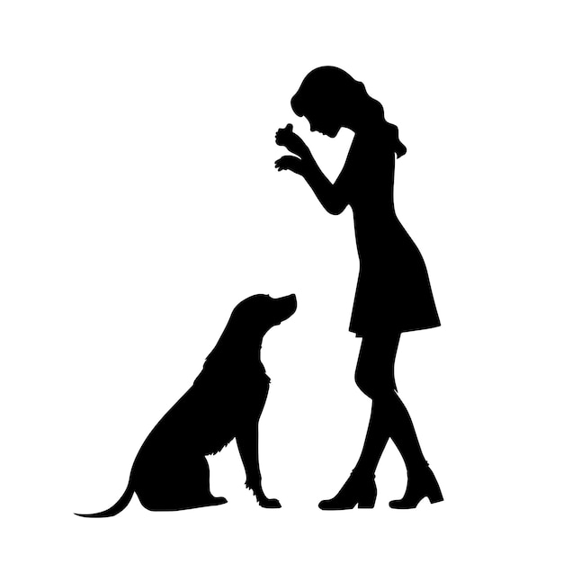 La ragazza insegna al cane a sedersi per la silhouette dei dolcetti