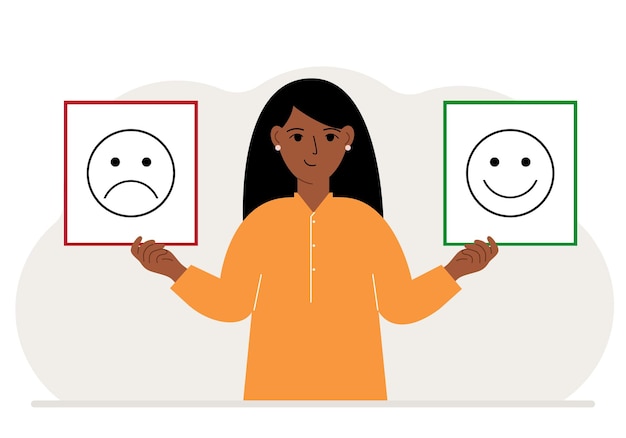 Glimlachende vrouw houdt een kaart vast met een trieste emoji in de ene hand en een lachende emoji in de andere hand het concept van emotiesmaskers of psychologische hulp