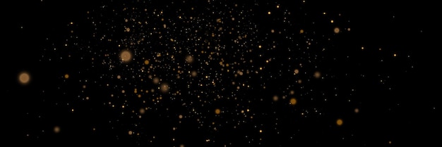 Glowing light effect in yellow gold color with lots of shiny particles isolated on dark background