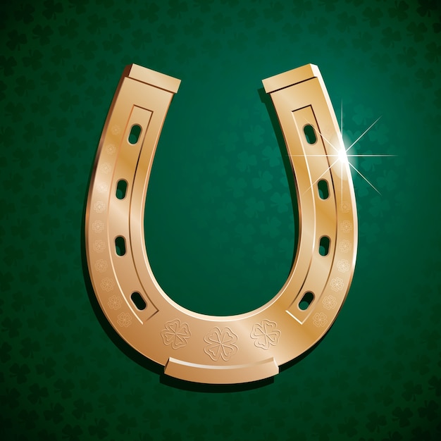Vector gold horseshoe on green background