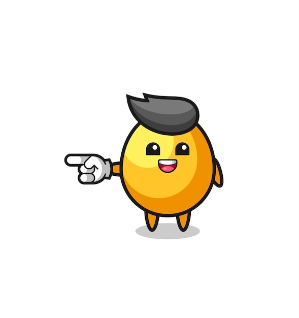 Golden egg cartoon with pointing left gesture