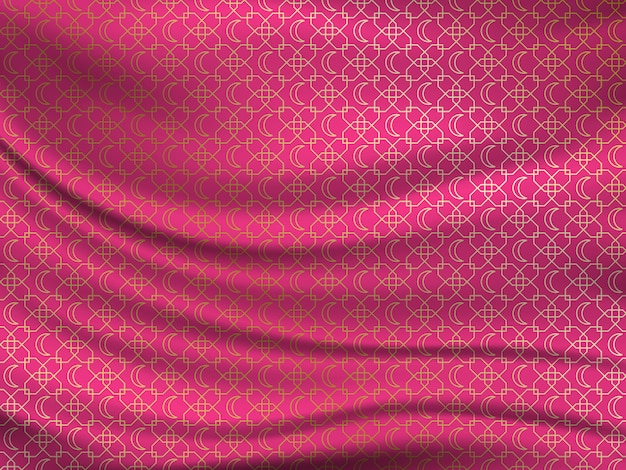 Golden oriental pattern on wavy silk fabric.