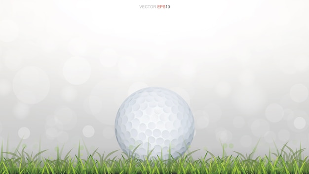 Vector golf ball on green grass field with light blurred bokeh background