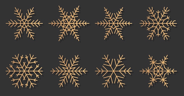 Gouden sneeuwvlokken elegante silhouetten pictogrammen instellen. Geweldig voor decoratiebanner Prettige kerstdagen en gelukkig Nieuwjaar. Trendy gouden kleurovergang verschillende vormen van sneeuw.