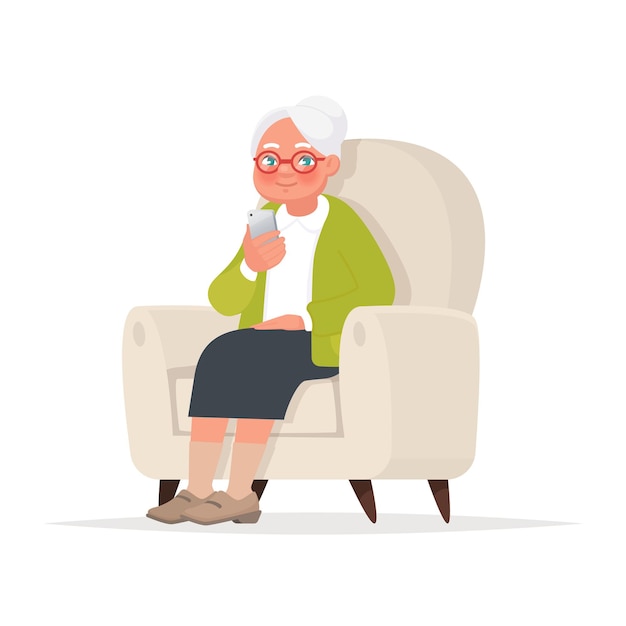 Grandmother sits in a chair and holds a phone in her hand.