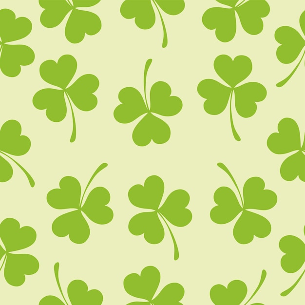 Green clovers on a yellow background