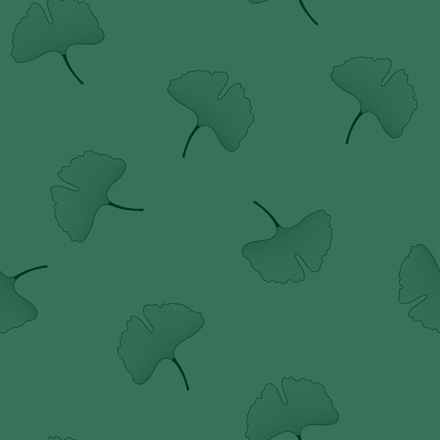 Green ginkgo biloba leaves on emerald background