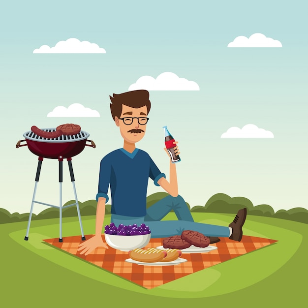 grill barbecue met een bebaarde man die een frisdrank in een tafelkleed drinkt
