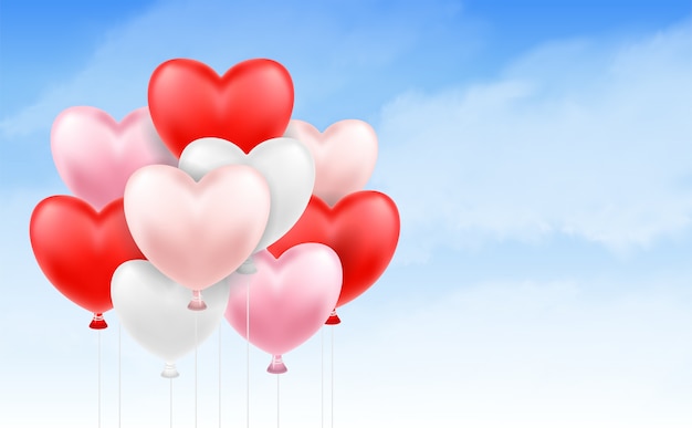 group of heart balloon floating in blue sky