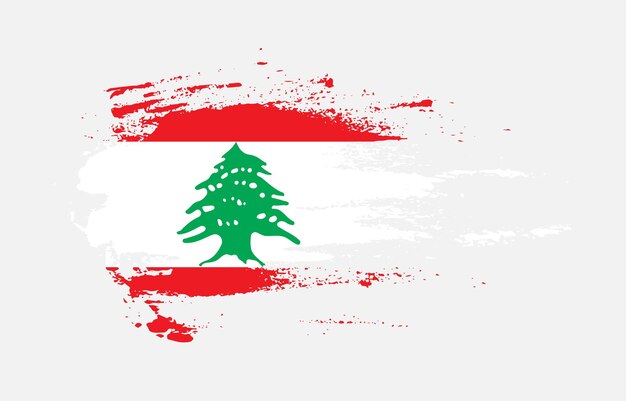 Grunge brush stroke flag of Lebanon with painted brush splatter effect on solid background