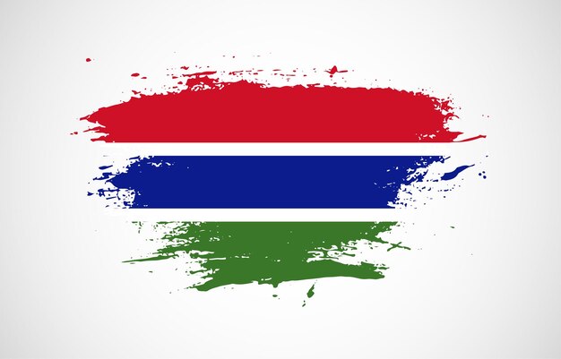 Grunge brush stroke with the national flag of Gambia on a white isolated background