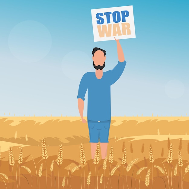 The guy in full growth holds a poster with the inscription stop the war rural landscape with wheat field and blue sky in the background