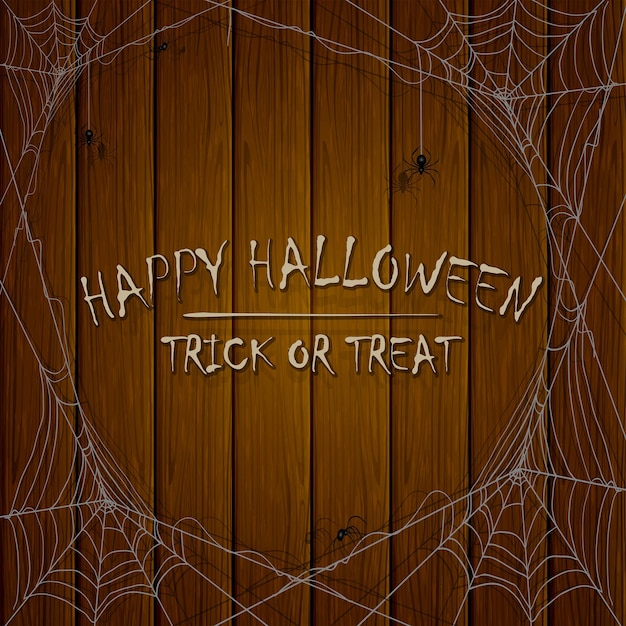 Halloween wooden background with spiders and cobwebs