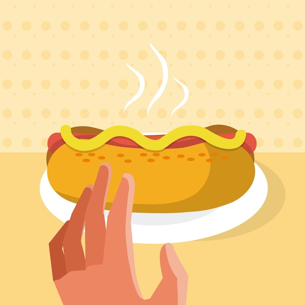 Mano che afferra un hot dog dal piatto