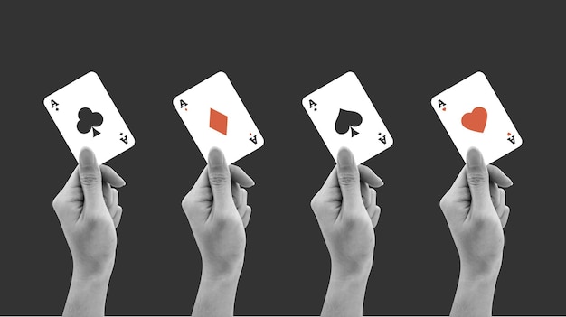 Hand holding aces solitaire playing cards Clubs diamonds hearts and spades sign