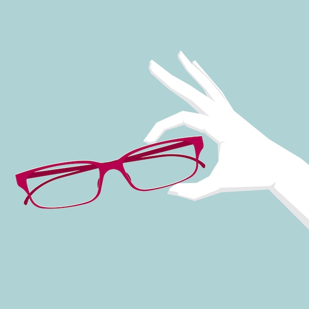 The hand holding glasses.Isolated on blue background.