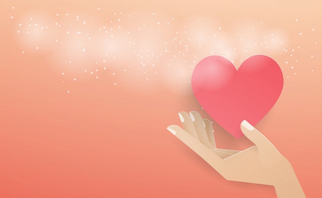 Vector hand holding a red heart floating out of the envelope with a white spray on the pink background