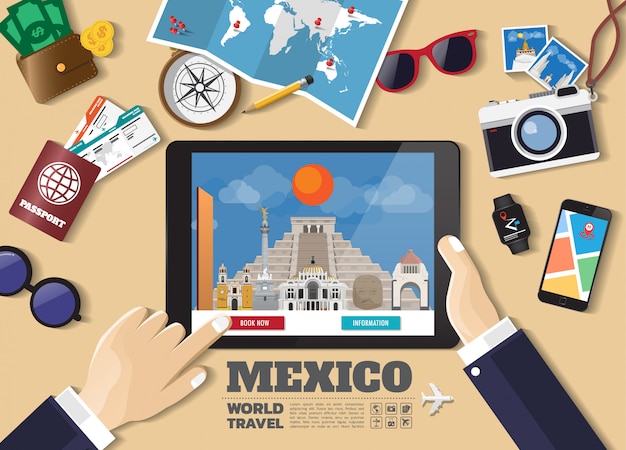 Hand holding smart tablet booking travel destination. mexico famous places