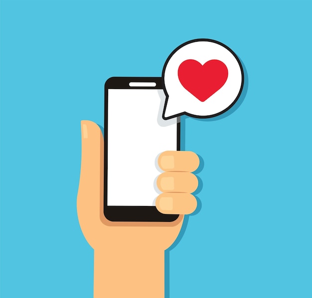 Hand holding smartphone with heart bubble chat