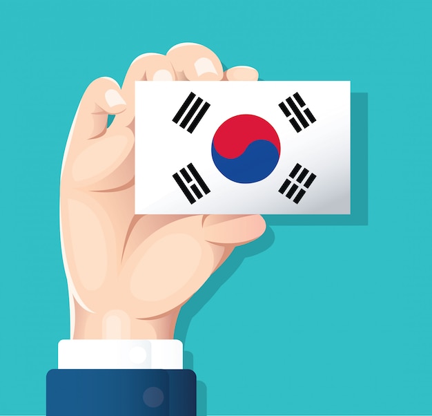 Hand holding south korea flag card