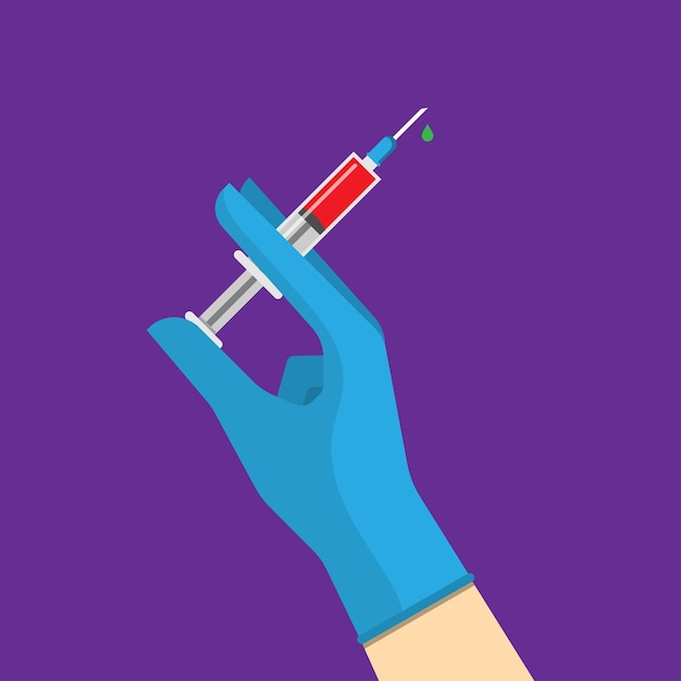 Hand holding syringe