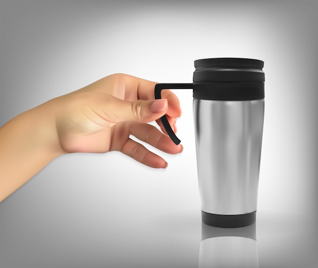 Hand holding a thermos cup