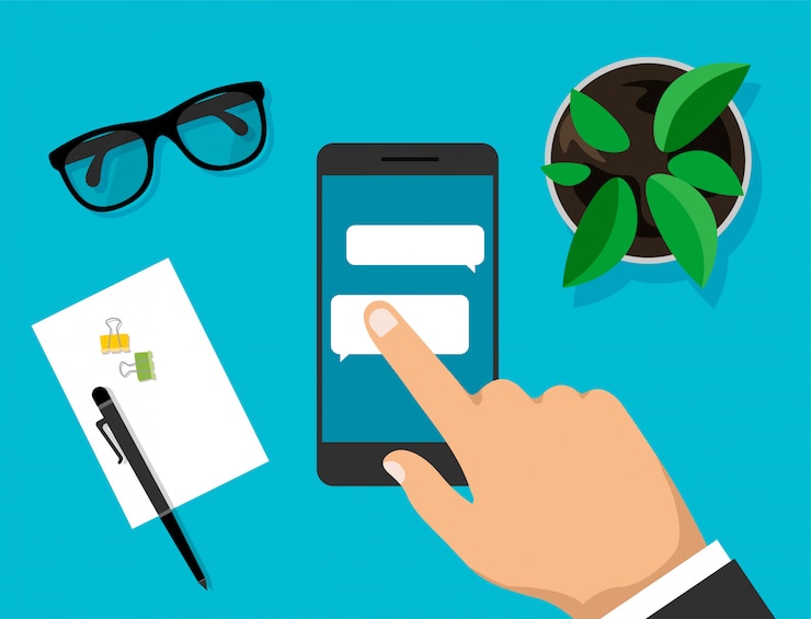 Vector hand holds smartphone with dialog boxes and click on it. phone with messaging bubbles on display. workspace top view. modern business work desk top in trendy style. illustration.