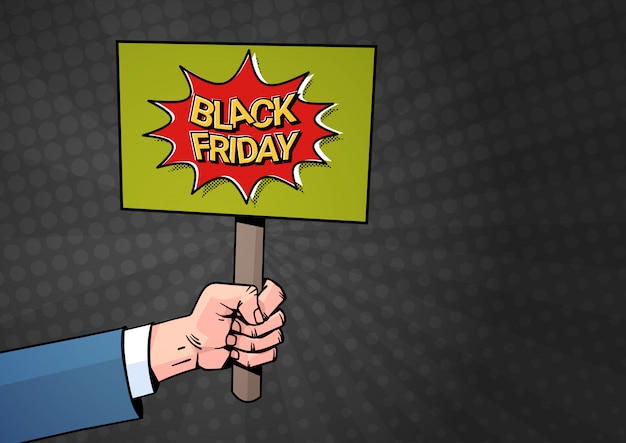 Hand houden plakkaat banner met black friday verkoop tekst