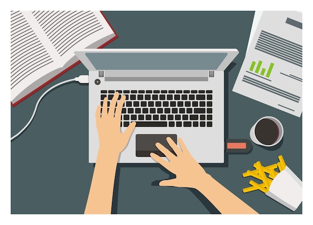 hand typing laptop surrounded with snacks coffee and other things