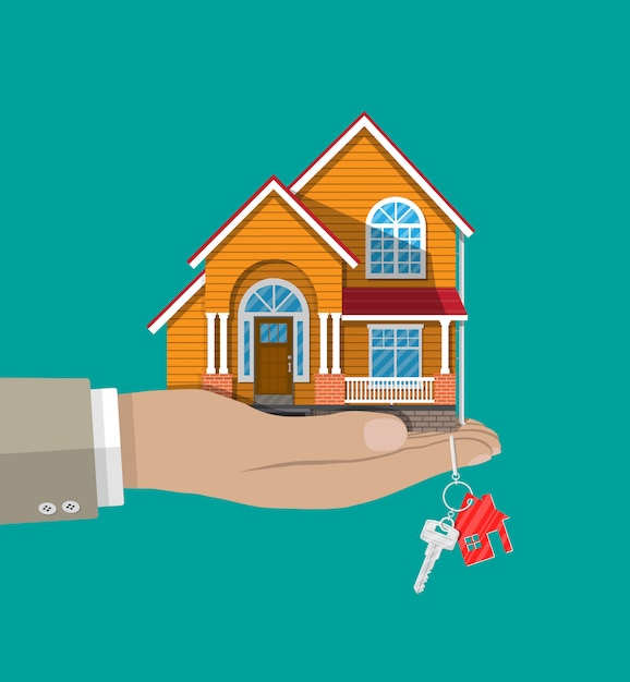 Vector hand with small house and keys