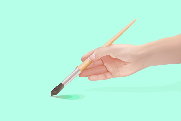 hand of young girl holding paintbrush