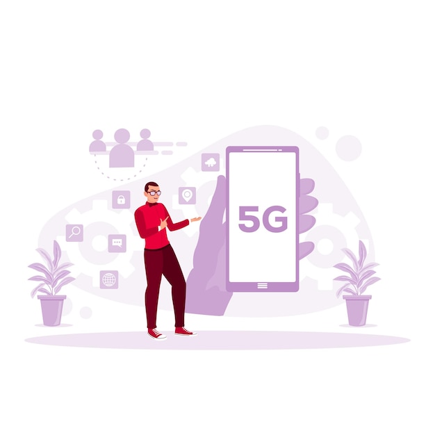 5Gネットワーク無線システムを搭載した携帯電話を手に持つビジネスマンが携帯電話を指差す