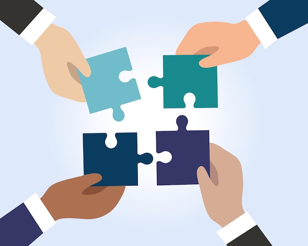 the hands of businessmen connect the pieces of puzzles into a single whole