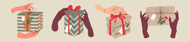 Hands holding Christmas gift in kraft paper with tag and berry. Present box in craft wrapping paper