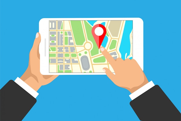 Hands holds tablet with map navigation on a screen. gps navigator with red pinpoint. city map with point markers.