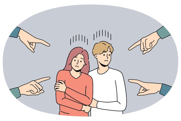 Hands pointing at unhappy young couple