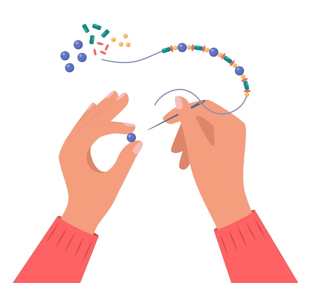 Hands string a bead on thread and making jewelry Handmade work creative craft hobby