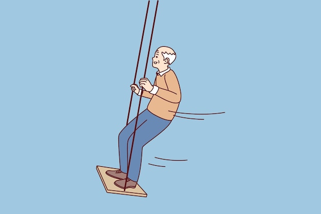 Happy active elderly grandfather swinging