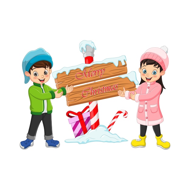 木製の看板と冬の服で幸せな男の子と女の子