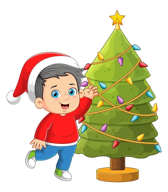 Vettore il ragazzo felice sta decorando e correndo intorno all'albero di natale