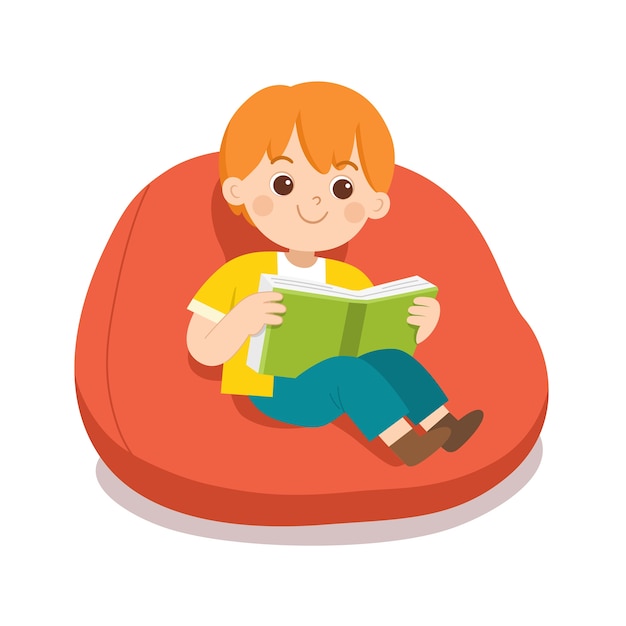 Happy boy reading a book sitting on sofa in room