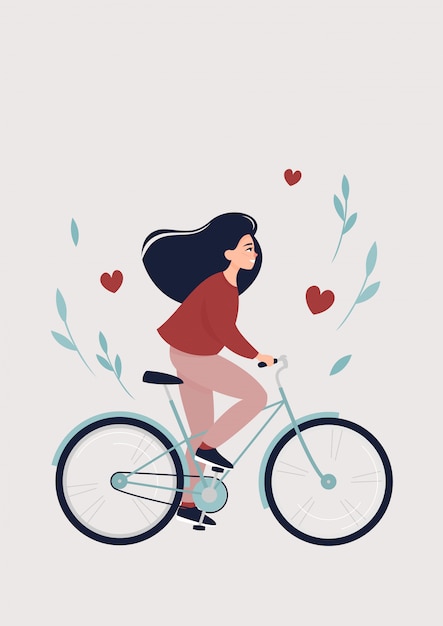 Счастливая брюнетка женщина едет на велосипеде, чтобы встретить весну